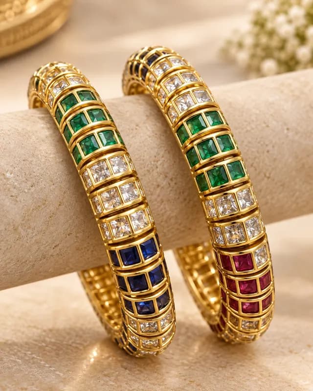Gemstone bangles — emerald, sapphire and ruby in gold